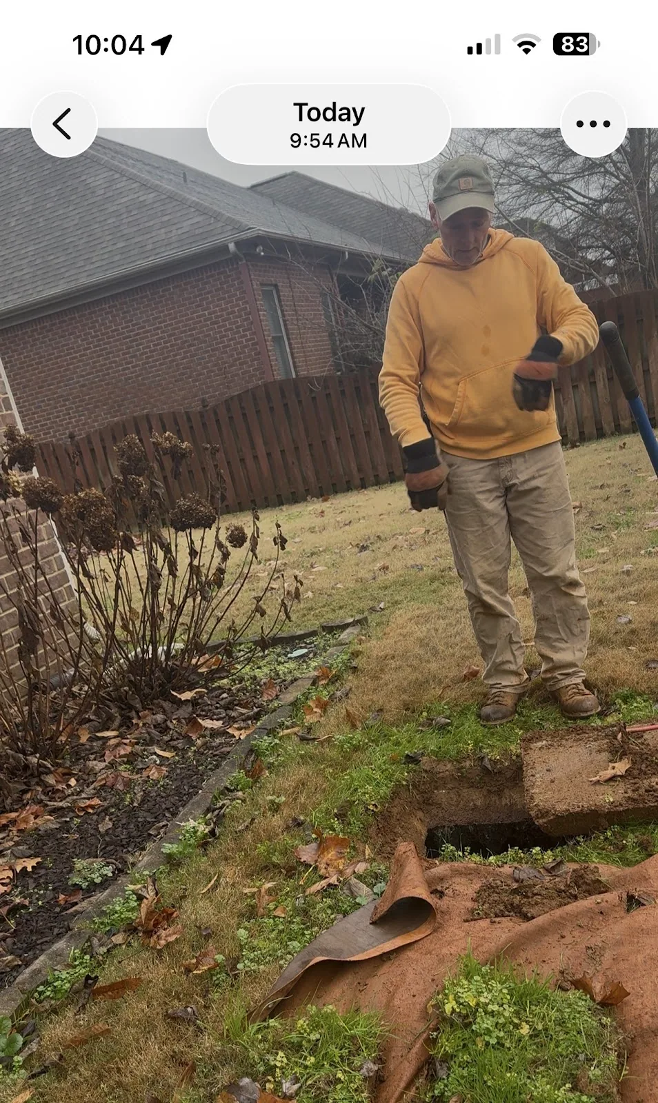 Aardvark technician on a winter septic service call in a residential yard